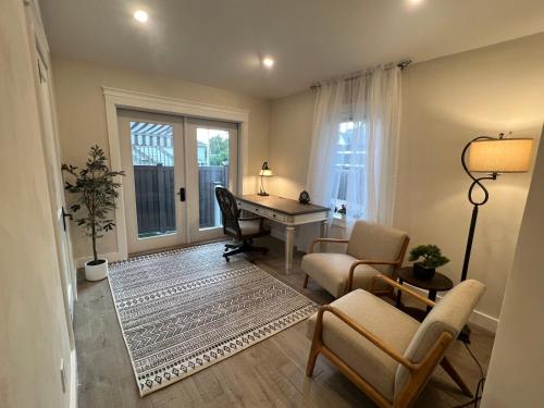 a living room with a desk and a table at The Reminisce vacation home 5br/3bt,downtown BH in Bar Harbor
