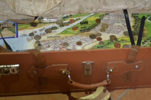 an open suitcase with a map of a park at Hotel Cineholiday in Naples