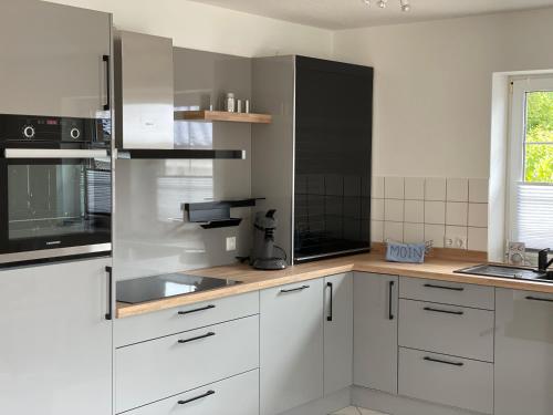 Dapur atau dapur kecil di Strandlächeln Lodge - Ferienwohnung mit 2 Schlafzimmern