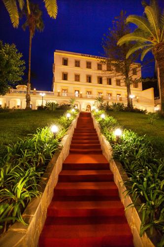 a staircase leading up to a building with lights at Grand Hotel Villa de France in Tangier