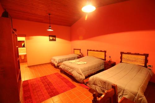 Ένα ή περισσότερα κρεβάτια σε δωμάτιο στο hosteria camino del inca