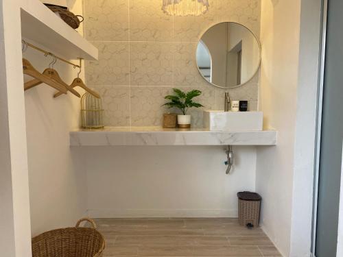 a bathroom with a sink and a mirror at Winnerview II - Mountain in Ko Larn