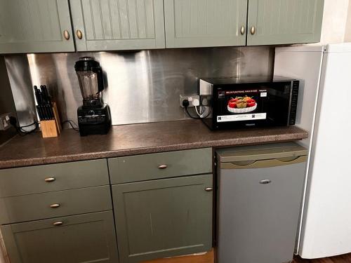 a microwave sitting on a counter in a kitchen at BLACKPOOL MERCY Inn HOTEL in Blackpool