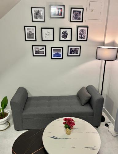 a living room with a couch and a table at Modern Vacation Home Apartelle Near Centro in Iriga City