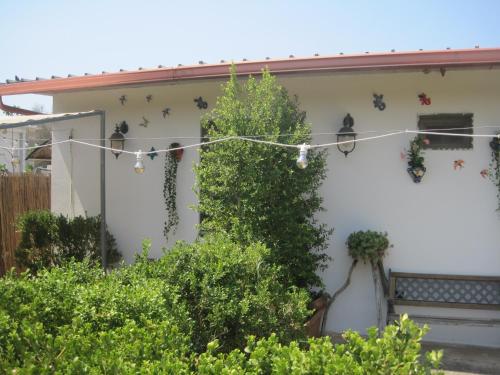 a house with christmas decorations on the side of it at Tenuta Innocenzi in Sanarica