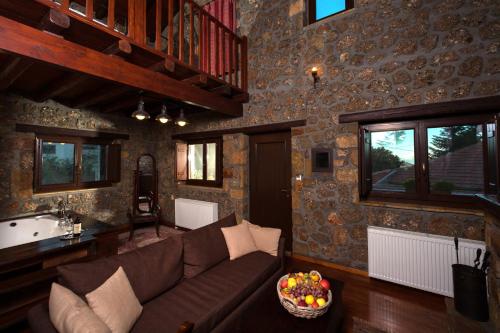 a living room with a couch and a sink at Pera Alonia Guest House in Kato Trikala Korinthias