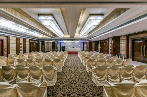 a room with rows of chairs in a banquet hall at The Regenza By Tunga in Navi Mumbai