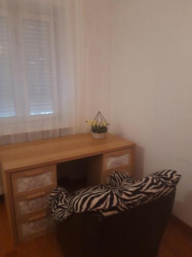 a room with a desk and a zebra print chair at ClickTheFlat Legionowo Apart Rooms in Legionowo