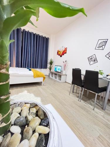 a living room with a bed and a table at VIT Apartment - Free Parking - O2 Arena in Prague