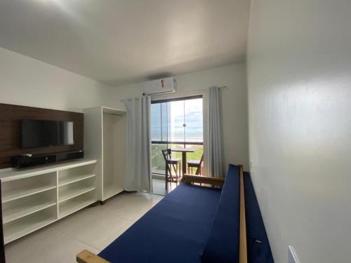 a living room with a blue trampoline in a room at Condominio Boa Vista in Pontal do Paraná