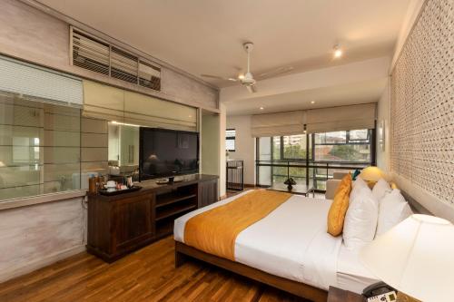 a bedroom with a large bed and a television at Rockwell Colombo in Colombo