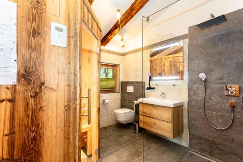 a bathroom with a sink and a toilet at Haus Eder in Saalfelden am Steinernen Meer