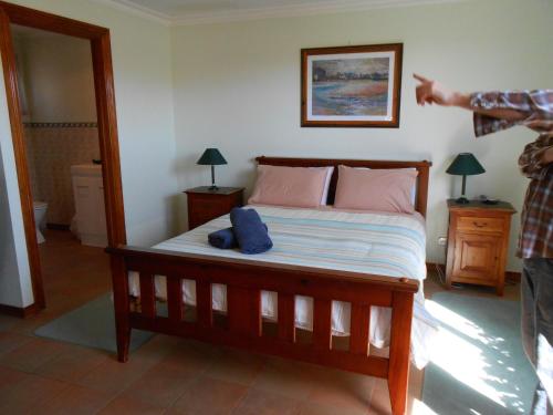 A bed or beds in a room at Tidelines of Bicheno
