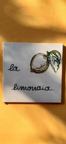 a sign on a wall with a picture of an onion at la limonaia in Florence