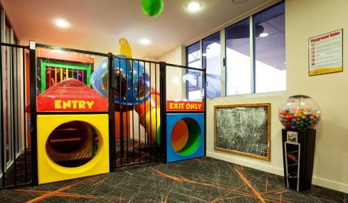 a room with a play room with a play gym at Vale Hotel in Townsville