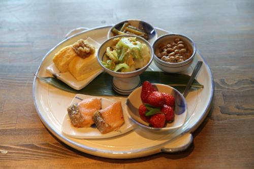 a plate with different types of food on a table at Shinwaen in Aso