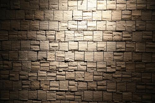 a black and white photo of a brick wall at Shinwaen in Aso