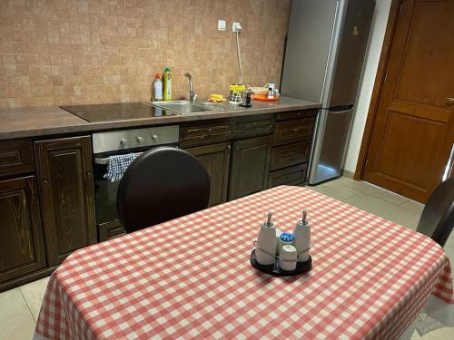 a kitchen with a table with a toy on it at Pensiunea Rares in Bistriţa Bîrgăului