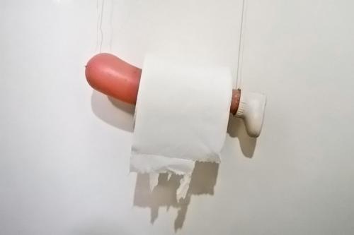 a hot dog sticking out of a wall at ViaVia Guesthouse in Yogyakarta