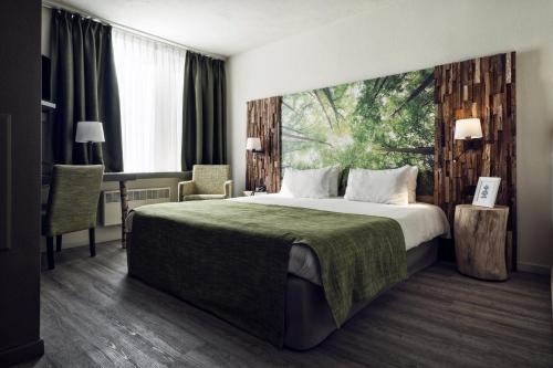 Postel nebo postele na pokoji v ubytování Hotel Zuid