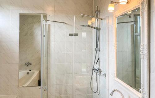 a bathroom with a shower with a glass door at 3 Bedroom Cozy Home In Vlagtwedde in Vlagtwedde