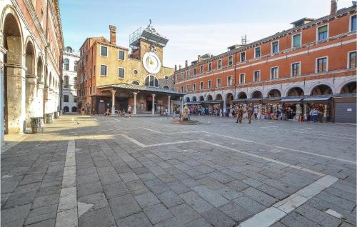 a city street with a clock tower and buildings at Nice apartment in Venezia with 2 Bedrooms and WiFi in Venice