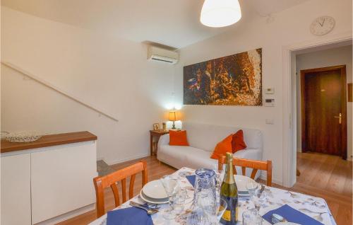 a kitchen and a living room with a dining table at Da Eva E Vera in Mestre