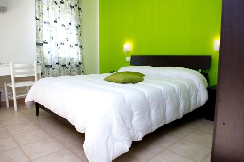 Postel nebo postele na pokoji v ubytování Azienda Agrituristica e Didattica CrauNari