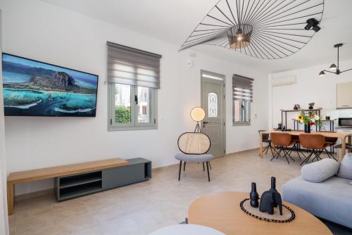 a living room with a couch and a table at Afroditi Suite in Loutra