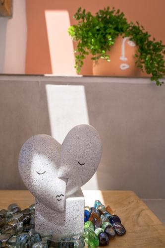 two hearts sitting on top of a pile of rocks at Afroditi Suite in Loutra