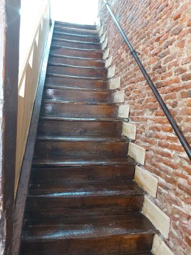 a stairway leading up to a brick wall at Madrid Apartamento Abuhardillado in Madrid