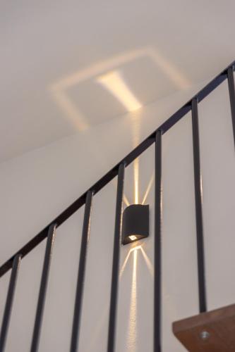 a ceiling light on a wall next to a fence at Ntinas Filoxenia Hotel & Spa in Skala Potamias