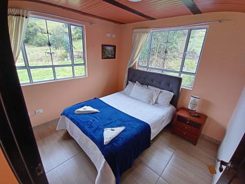 Postel nebo postele na pokoji v ubytování Portal de la Cascada - Mongui