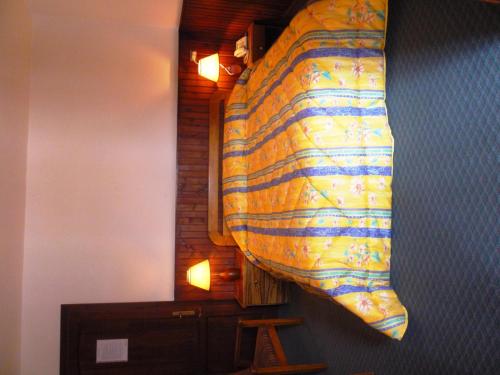 a large blanket hanging on the wall of a room at Hotel Chbat in Bcharré
