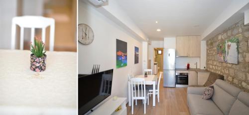 a kitchen and a living room with a couch and a table at Apartments PROVA in Sveti Stefan