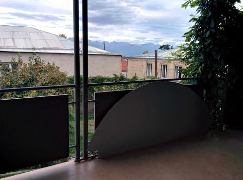 a view of a balcony with a large window at GuestHouse Natali in Tʼelavi