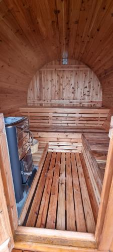 an inside of a sauna with a wooden floor at Quinta Rico - House II in Praia da Vitória