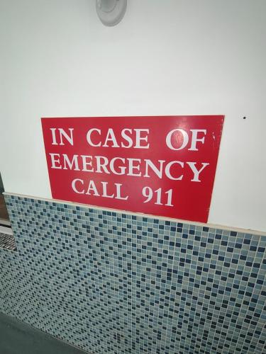 a red sign on top of a tiled wall at Country Inn & Suites by Radisson, Buford at Mall of Georgia, GA in Buford