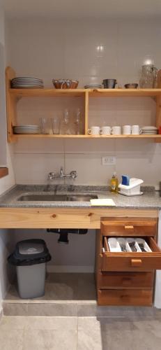 a kitchen with a sink and a counter top at Casa Mármol 2085 MDZ Mendoza in Godoy Cruz