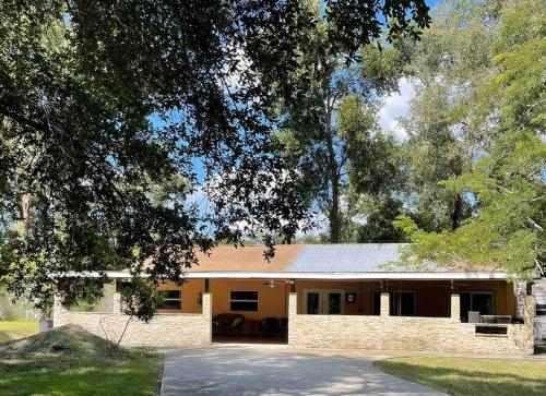 a large brick house with a driveway in front of it at The Piano House in Orlando