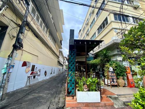 an empty street in front of a building at KC guest house in Bangkok