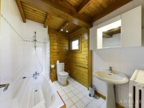 a bathroom with a toilet and a sink at Chalet Montvalezan-La Rosière, 9 pièces, 14 personnes - FR-1-398-647 in Montvalezan