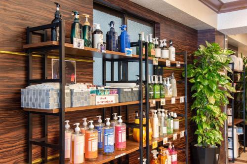 a room with shelves filled with lots of products at Yokohama Sakuragicho Town Hotel in Yokohama