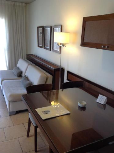 a living room with a couch and a table at Olas Apart High Comfort in Villa Gesell