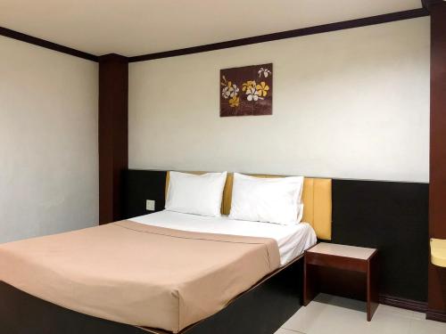 En eller flere senge i et værelse på Visanuinn Hotel