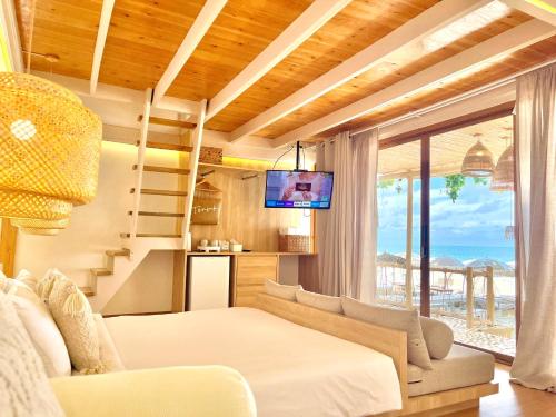 Tempat tidur dalam kamar di Tonsak Resort
