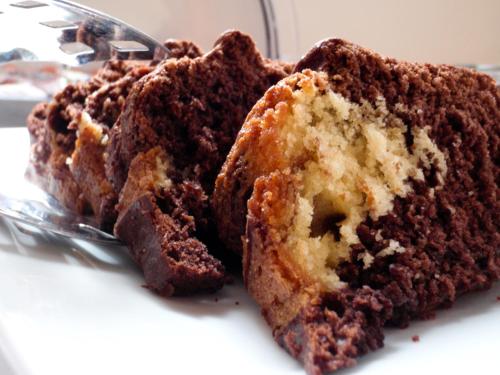 a close up of a piece of chocolate cake at Belina Hotel in Portariá