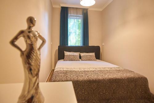 Postel nebo postele na pokoji v ubytování SUNLIGHT Silver Plus Szeged