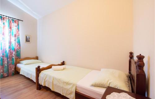 Katil atau katil-katil dalam bilik di Three-Bedroom Apartment In Ostrvica