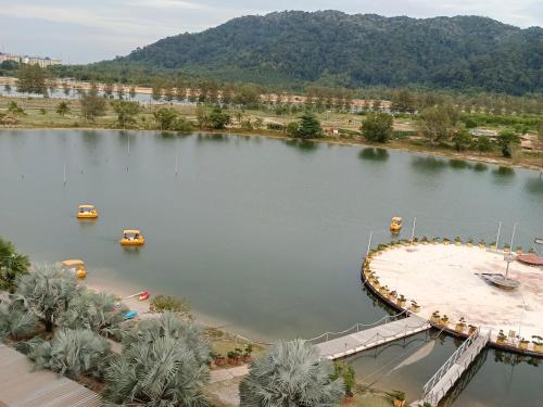 an aerial view of a lake with boats in it at Glossy Marina Homestays in Lumut